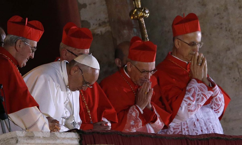 Newly elected Pope Francis appears on the balcony of St. Peter's Basilica after being elected by the conclave of cardinals, at the Vatican